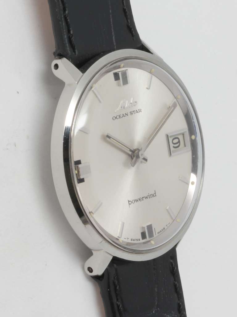 Mido stainless steel Ocean Star Powerwind wristwatch with date, circa 1960s. 34 X 35mm case and signed Mido crown. With silvered satin dial featuring unusual applied geometric indexes and stylized hands. Powered by a self-winding movement with sweep