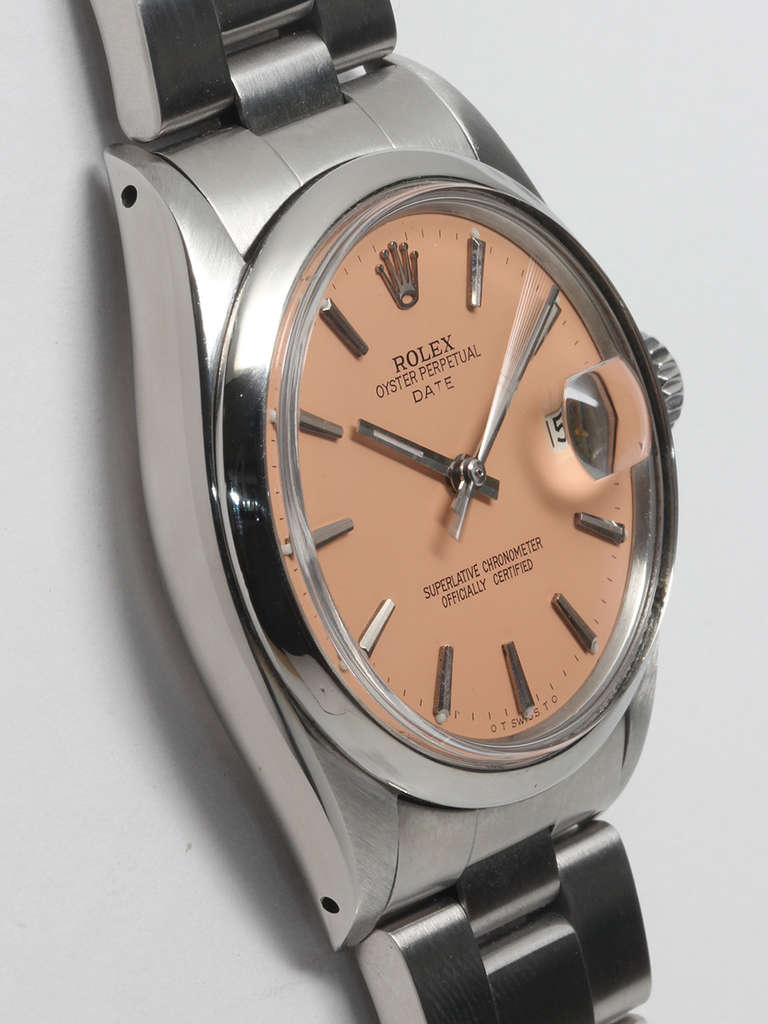 Rolex stainless steel Oyster Perpetual Date wristwatch, Ref. 1500, serial number 2.2 million, circa 1969. 34mm case with smooth bezel and acrylic crystal. Lovely custom-colored peach dial with applied indexes and hands. Powered by a self-winding