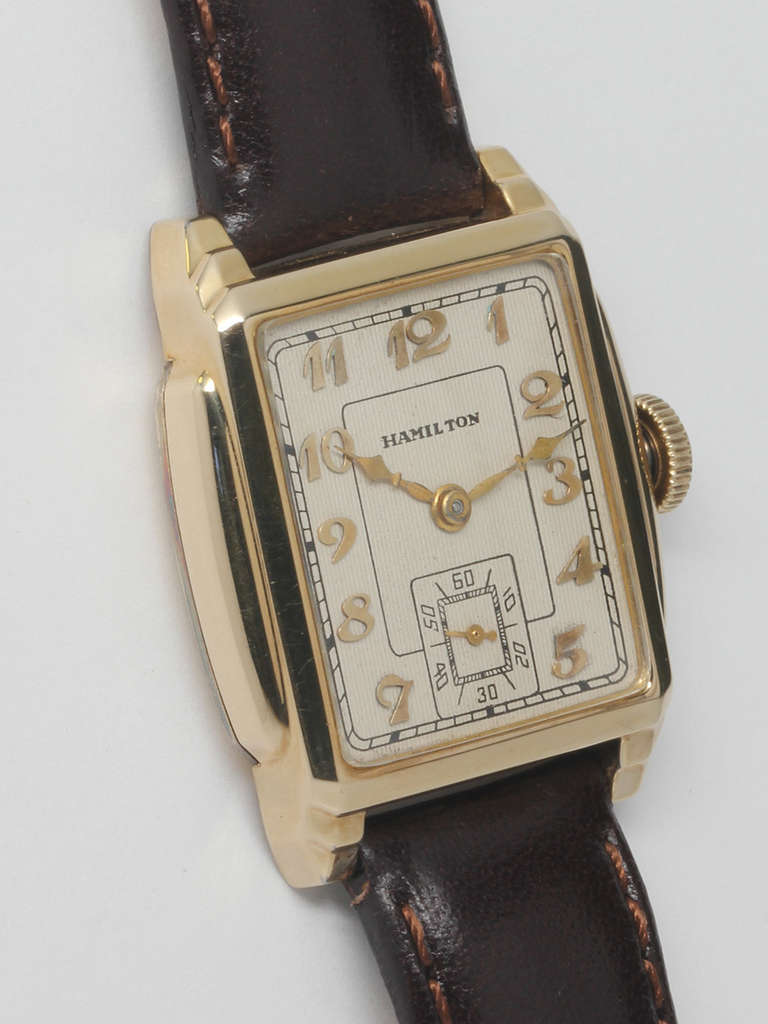 Hamilton yellow gold-filled Dixon wristwatch, circa 1930s. Rectangular stepped case, 27 x 39mm. Very pleasing silvered textured dial with applied oversize Breguet numerals. 17-jewel manual-wind movement with subsidiary seconds. An excellent