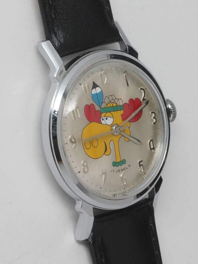 Buren base metal Bullwinkle wristwatch, circa 1970s. 34 x 42mm case with smooth bezel and acrylic crystal. Silvered dial with bright colored image of Bullwinkle and applied silver Arabic indexes and hands. 17-jewel manual-wind movement. Offered on