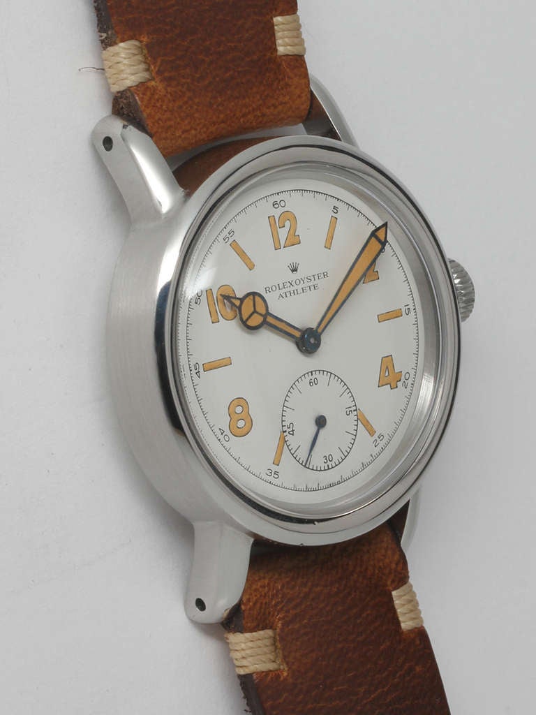 Rolex stainless steel Athlete wristwatch, circa 1940s. 32 x 40mm case with extended lugs, smooth bezel and acrylic crystal. Beautifully restored white dial with Arabic and baton indexes and matching Mercedes-style hands. Powered by a 17-jewel