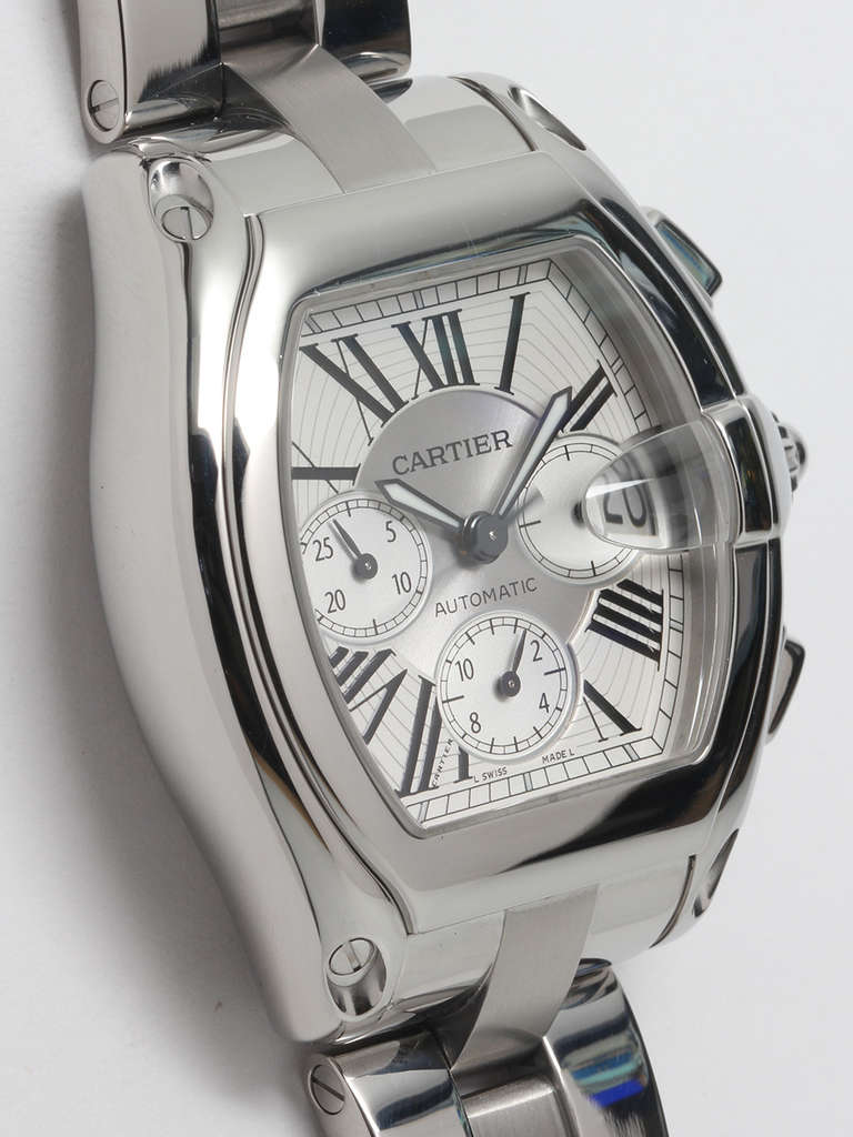 Cartier stainless steel Roadster chronograph wristwatch, circa 2000s. Oversize 43 X 49mm tonneau case. Three-register automatic movement. Original silvered textured dial with large Roman figures and luminous sword hands. With stainless steel