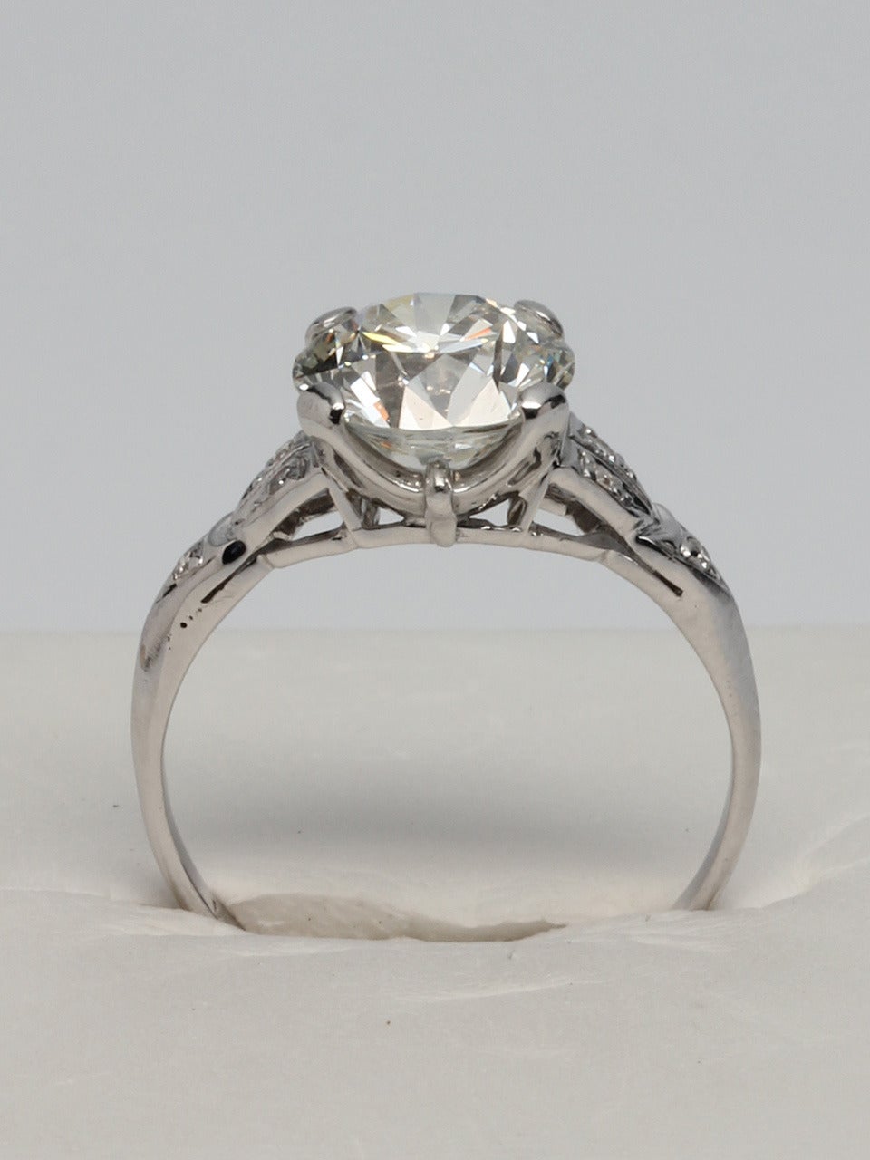 Classic Art Deco design vintage platinum engagement ring set with 2.05ct transitional cut center diamond, EGL Certified, I/VS2. Six single cut side diamonds add approximately 0.12ct. Geometric side motifs, open galleries and elevated center stone
