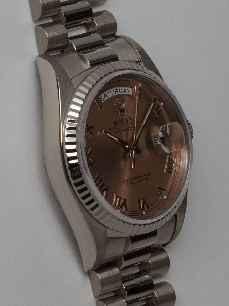 Rolex 18K White Gold Day-Date President Wristwatch ref 18239 serial #L6 circa 1988. 36mm diameter case with 18K white gold fluted bezel and sapphire crystal. With original salmon dial with heavy Roman figures and silver baton hands. Powered by self