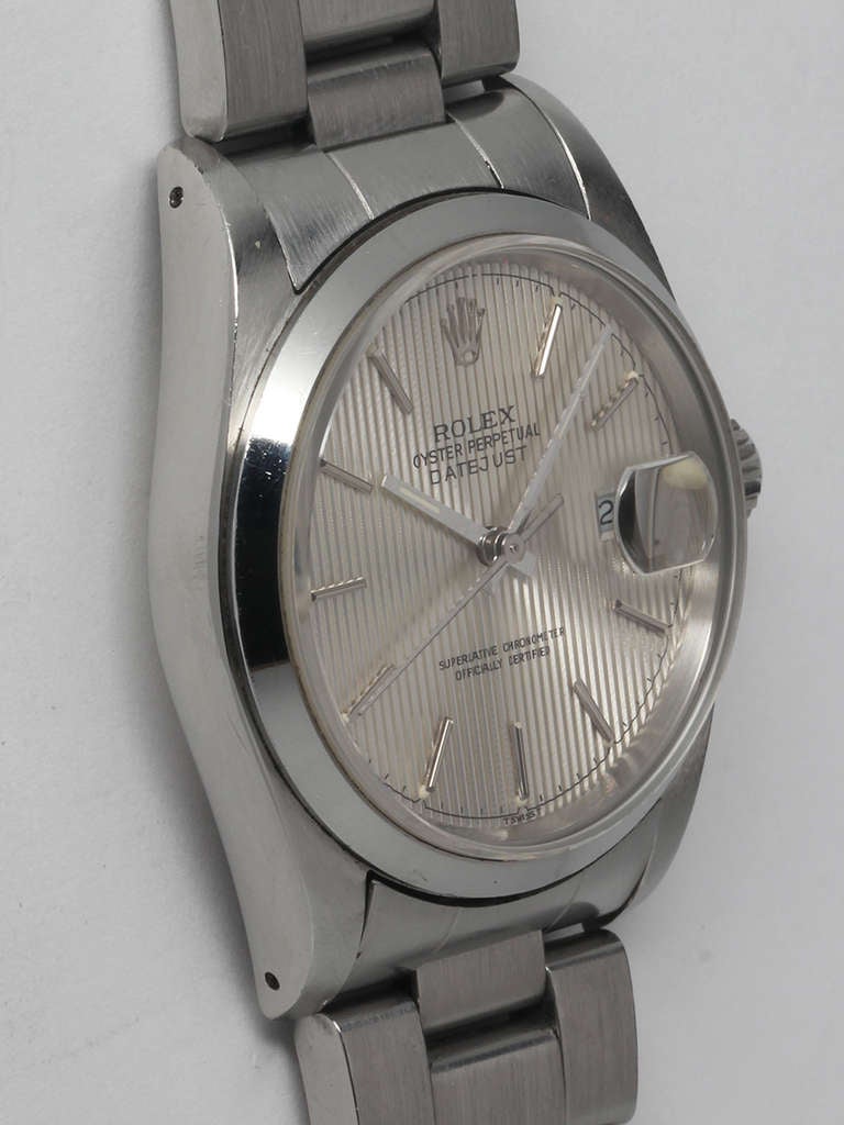 Rolex stainless steel Datejust wristwatch, Ref. 16200, serial number R5, circa 1987. 36mm diameter case with smooth bezel and sapphire crystal. With lovely silver-tone tapestry dial with applied indexes and baton hands. Powered by a self-winding
