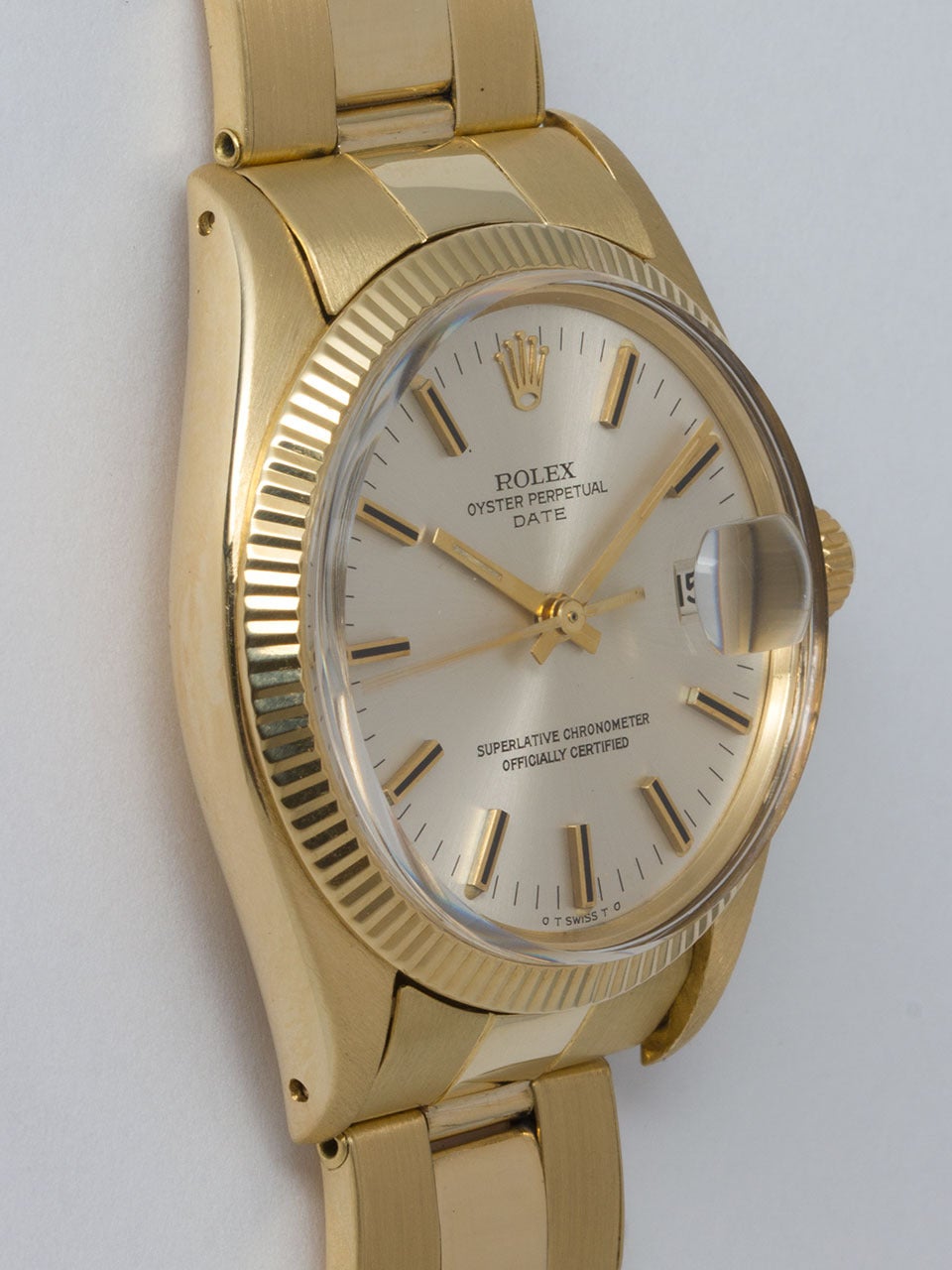 Rolex 14K Yellow Gold Oyster Perpetual Date ref 1503 serial #3.5 million circa 1973. 34mm diameter case with fluted bezel and acrylic crystal. Original silver satin dial with gold applied indexes and gilt baton hands. Powered by caliber 1570 self