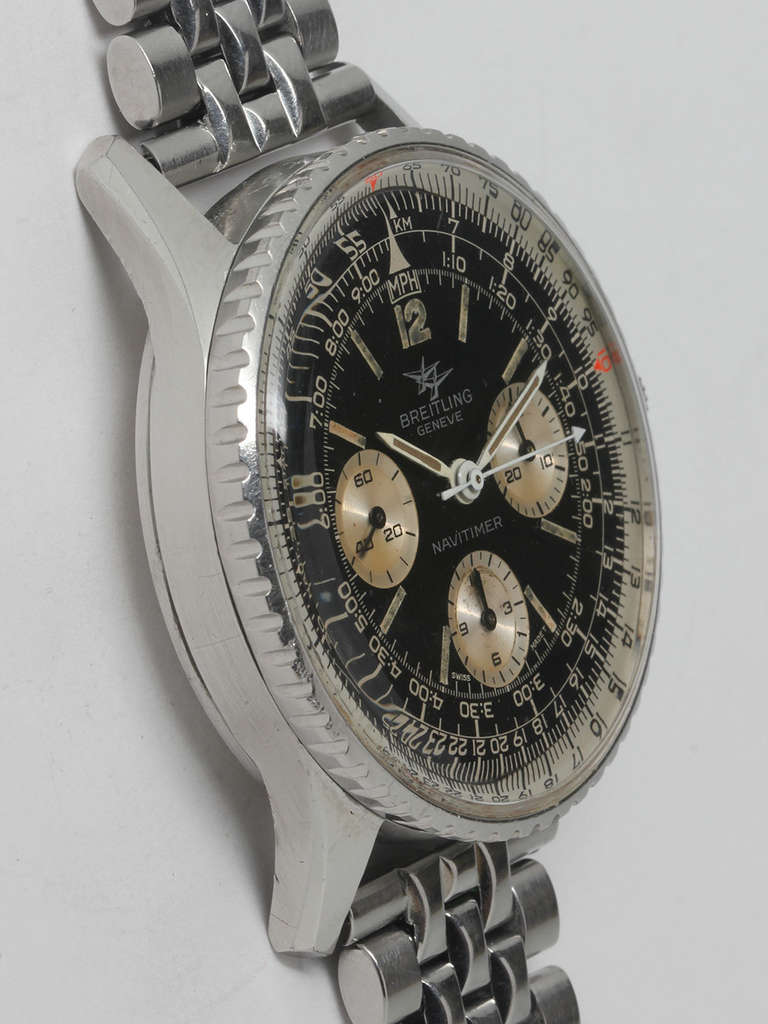 Breitling stainless steel Navitimer chronograph wristwatch, ref. 806, circa 1960s. 41 x 47.5mm case with rotating navigational bezel and signed crown. Original black dial with Breitling twin jets logo and three contrasting warm silvered registers.