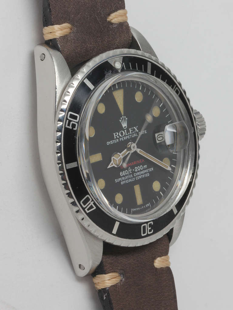 Rolex stainless steel red Submariner wristwatch, ref. 1680, serial no. 3.8million, circa 1974. 40mm diameter case with aluminum rotating time elapsed bezel and acrylic crystal. Original matte black dial with Submariner in red print. Brownish