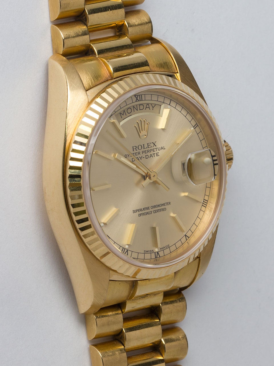Rolex 18K Yellow Gold Day Date Wristwatch ref 18038 serial #5.2 million circa 1978. Super sharp condition 36mm diameter full size man's model with beefy lugs, fluted bezel and sapphire crystal. Original champagne dial with applied gold indexes and