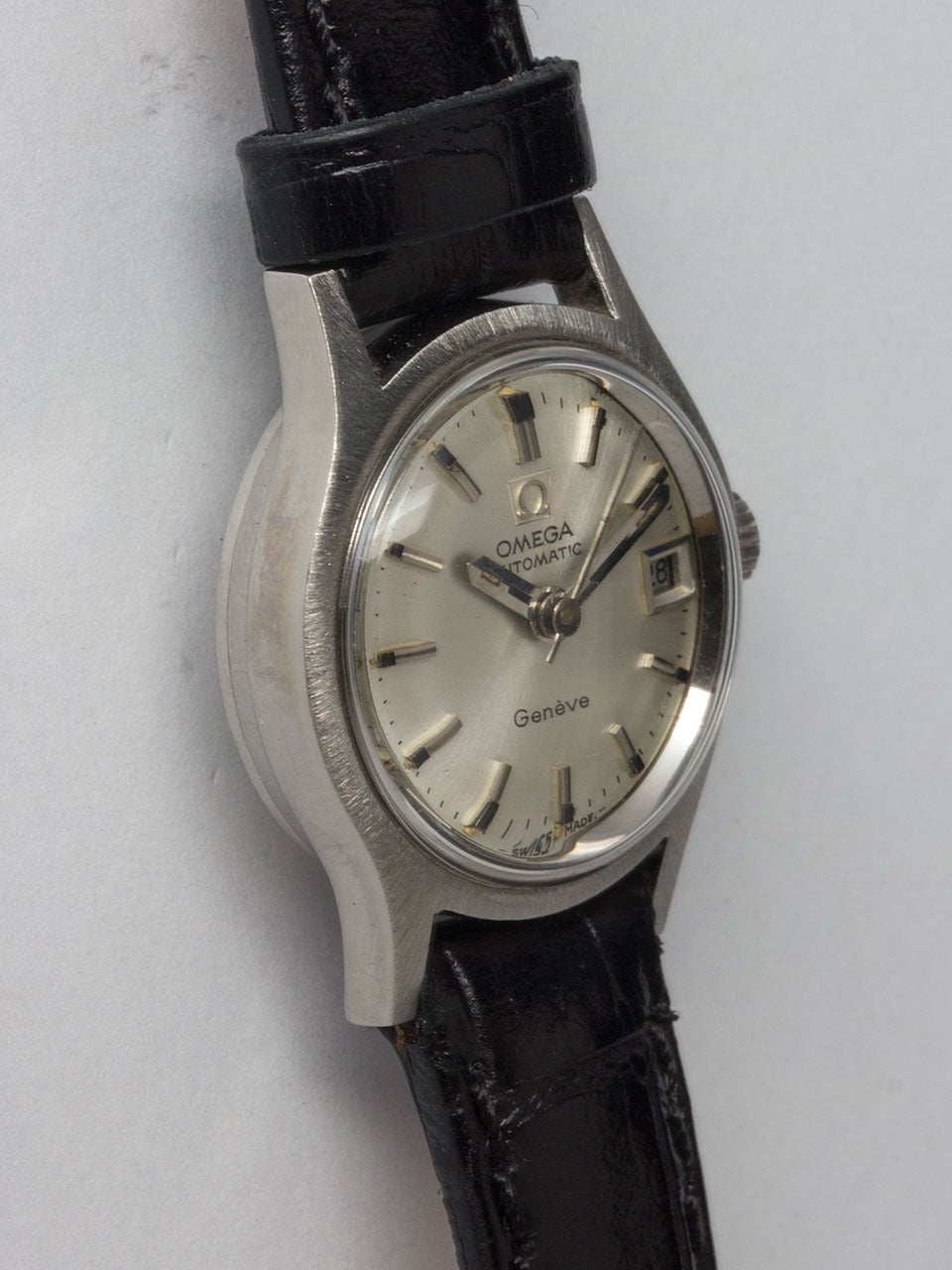 Omega Stainless Steel Lady's Geneve Automatic Wristwatch circa 1970. 20 x 26mm round case with bowed extended lugs and acrylic crystal. Original silver dial with applied silver indexes and baton hands. Powered by caliber 620 self winding movement