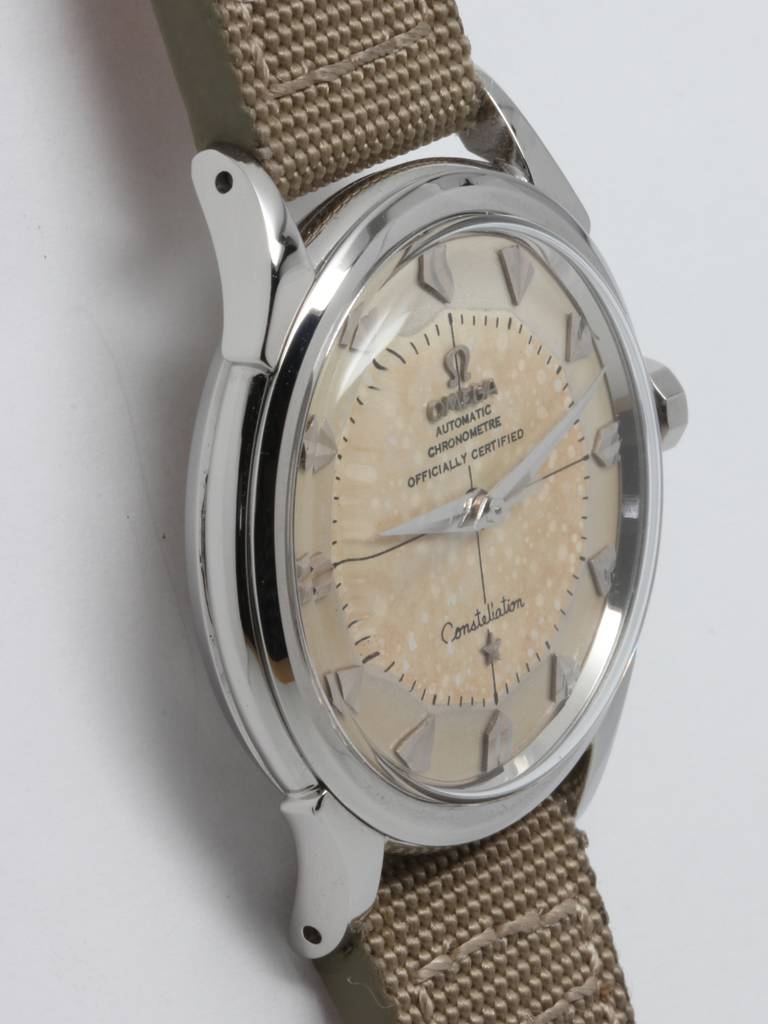 Omega stainless steel Constellation wristwatch, Ref. 2852-6 SC movement, serial number 15 million, circa 1956. 35 X 42mm case with down-turned lugs. Very pleasing patina'd pie pan dial with popular fan shaped indexes, cross hairs pattern, and