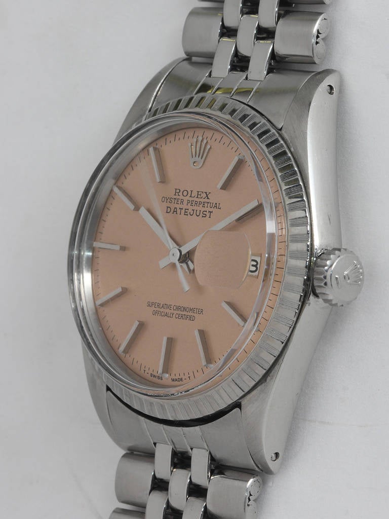 Rolex stainless steel Datejust wristwatch, Ref. 1601, serial number 3.2 million, circa 1972. 36mm case with fluted bezel and acrylic crystal. Stunning custom-colored salmon dial with applied indexes and baton hands. Powered by a self-winding 1560
