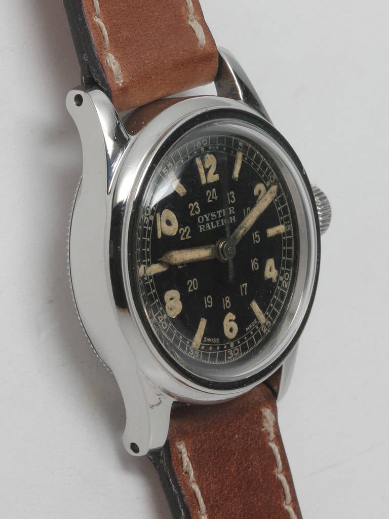 Rolex stainless steel Oyster Raleigh wristwatch, serial number 194,XXX, circa 1942. 29 x 35mm case with acrylic crystal and Oyster Patent + crown. Lovely black dial with patinaed luminous numbers, hands and inner 24 hours. Powered by a manual-wind