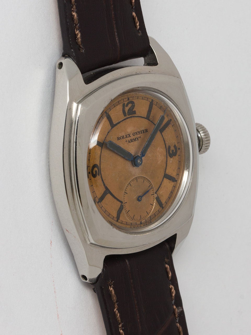 Rolex Stainless Steel Oyster Army ref 3139 serial # 381,xxx circa 1945. 31 x 38mm cushion shaped stepped design Oyster case with screw down back and period screw down crown. With original patina'd 2 tone salmon dial with patina'd luminous indexes