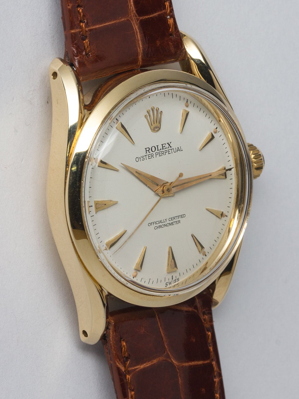 Rolex 14K Yellow Gold Bombe ref 6292 serial# 948,xxx circa 1953. 34 x 40mm bombe style case with bowed lugs, smooth bezel and acrylic crystal. Beautifully restored antique white dial with gold applied tapered indexes and hands. Powered by Rolex