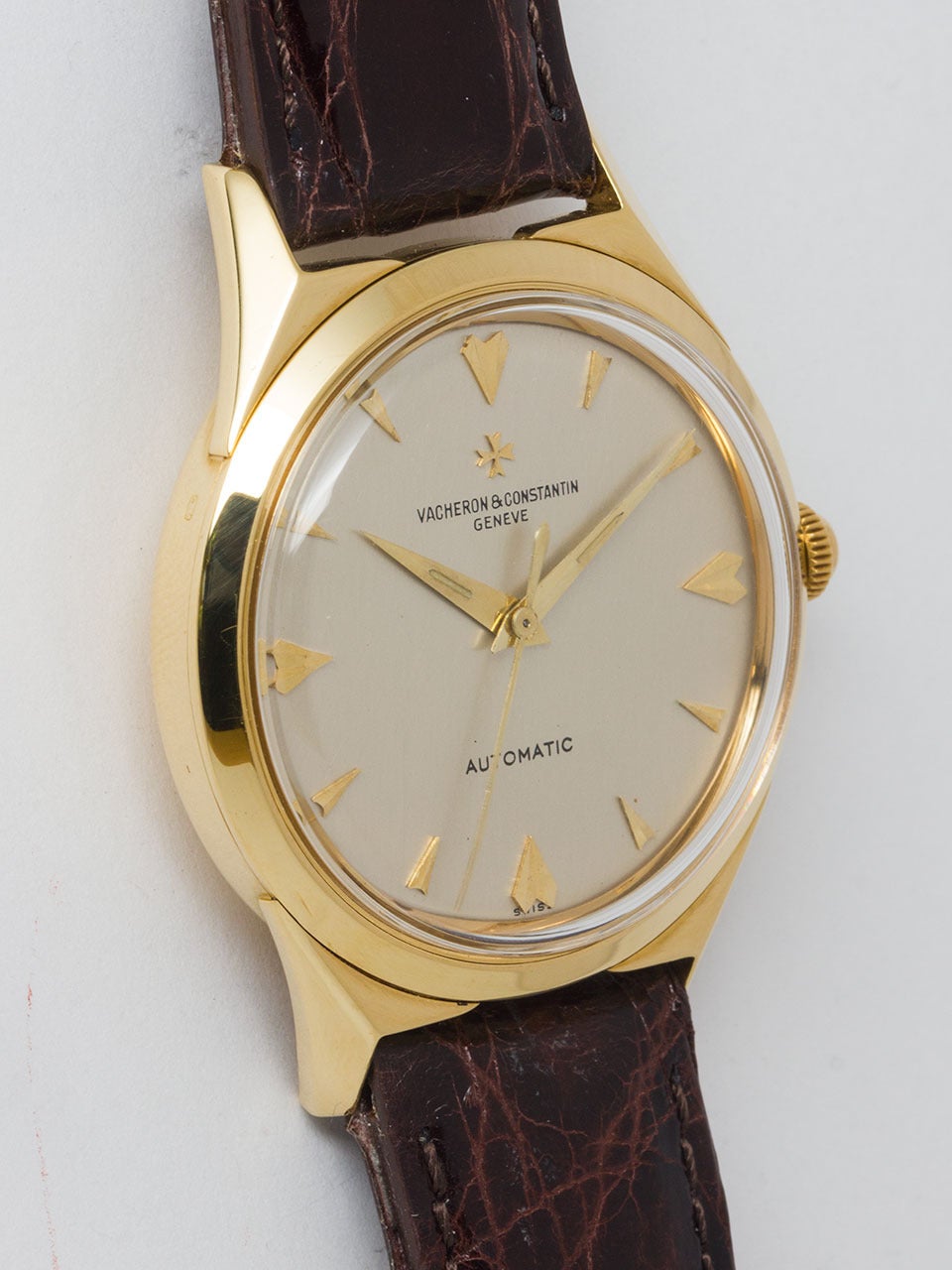 Vacheron & Constantin 18K Yellow Gold Automatic ref 6073 circa 1960's. 36 x 44mm large sculpted flared lug tonneau shaped case with screw down caseback. Original silvered satin dial signed Vacheron & Constantin Geneve Automatic. With applied chevron