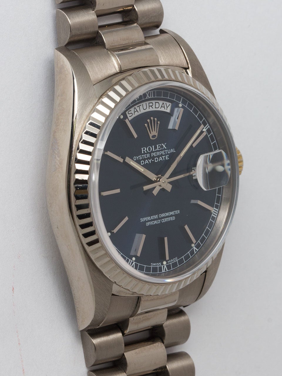 Rolex 18K White Gold Day Date President ref 18039, serial #K circa 1988. 36mm diameter case with fluted bezel and sapphire crystal. Very pleasing original sapphire blue dial with applied silver indexes and hands. Powered by calibre 3055 self winding