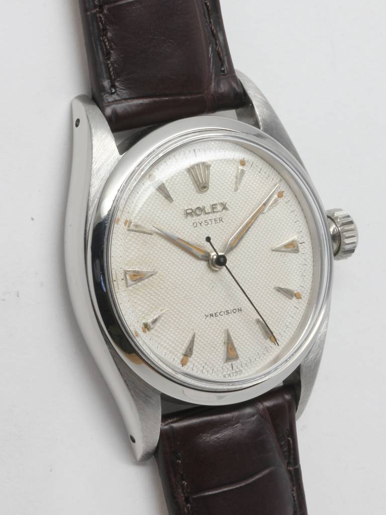 Great looking vintage Rolex stainless steel Oyster wristwatch, Ref. 6422, serial number 69,XXX, circa 1955, with manual-wind movement. 34mm case with dome bezel and acrylic crystal. Beautiful original waffle dial with raised triangular indexes and