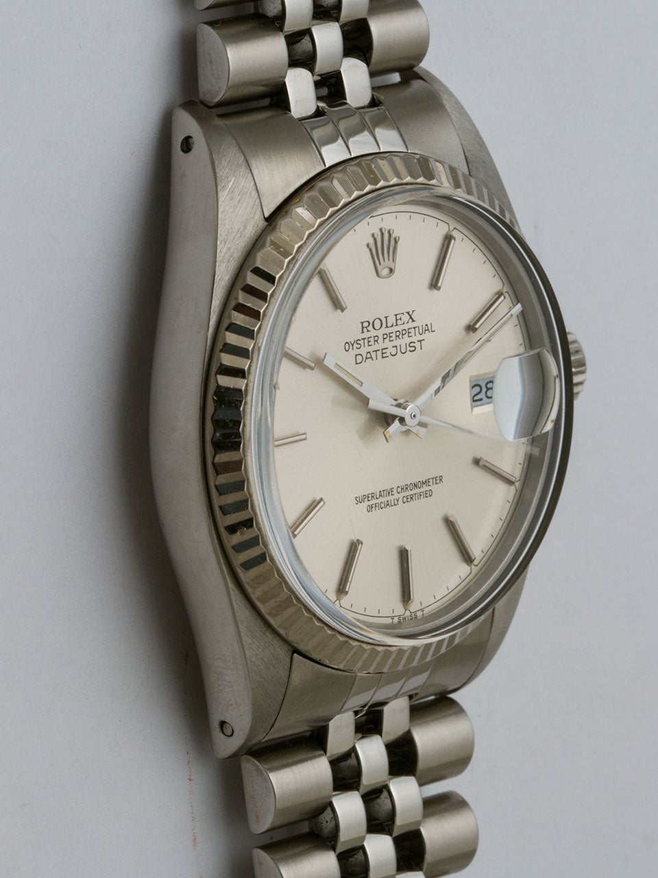 Rolex Stainless Steel Datejust ref# 16014 serial# 8.9 million circa 1985. 36mm diameter case with 18K white gold fluted bezel and acrylic crystal. Original silvered satin dial with applied silver indexes and silver baton hands. Powered by self