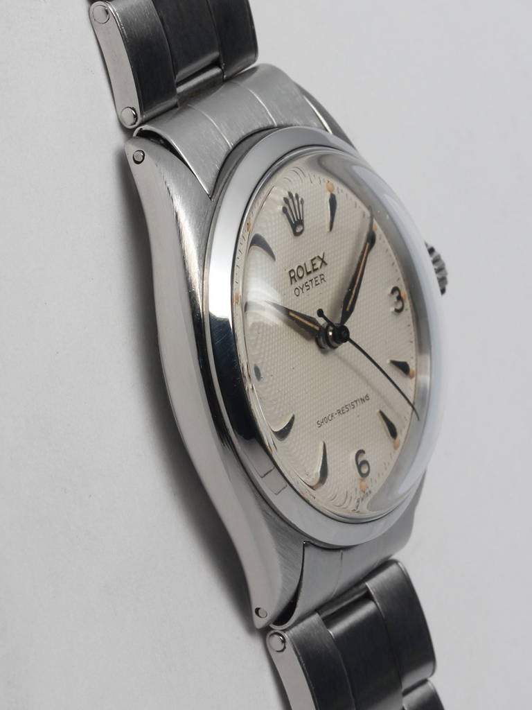 Rolex stainless steel Oyster wristwatch, Ref# 6480, production serial # 96,XXX, circa 1955. 34mm Oyster case with smooth bezel and acrylic crystal. Exceptional condition original waffle dial with applied 3/6/9 and arrow head indexes, original