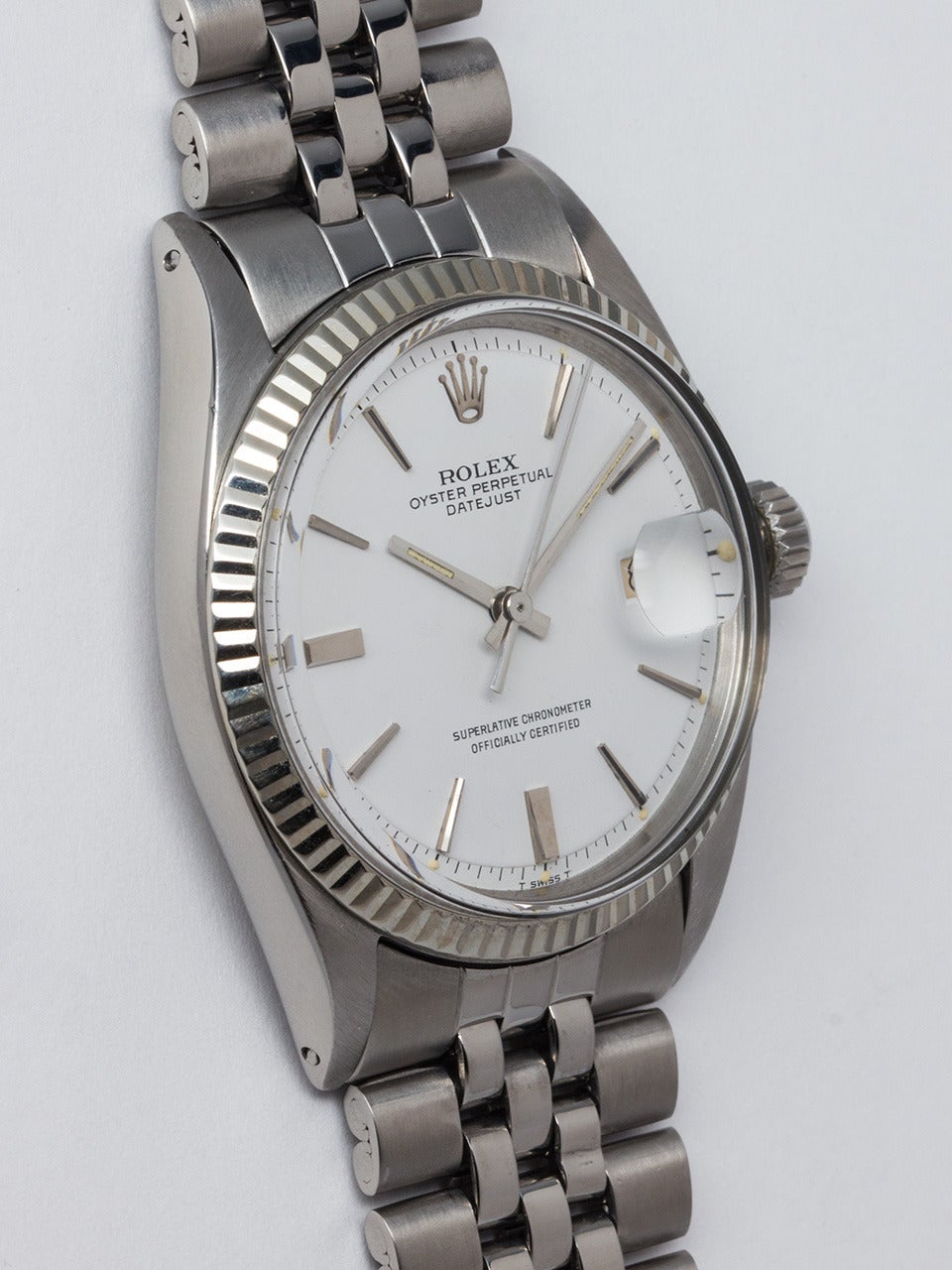 Rolex Stainless Steel Datejust Wristwatch ref 1601 serial #9.5 million circa 1963. 36mm diameter case with 14K white gold fluted bezel and acrylic crystal. Original white pie pan dial with applied silver indexes and silver baton hands. Powered by