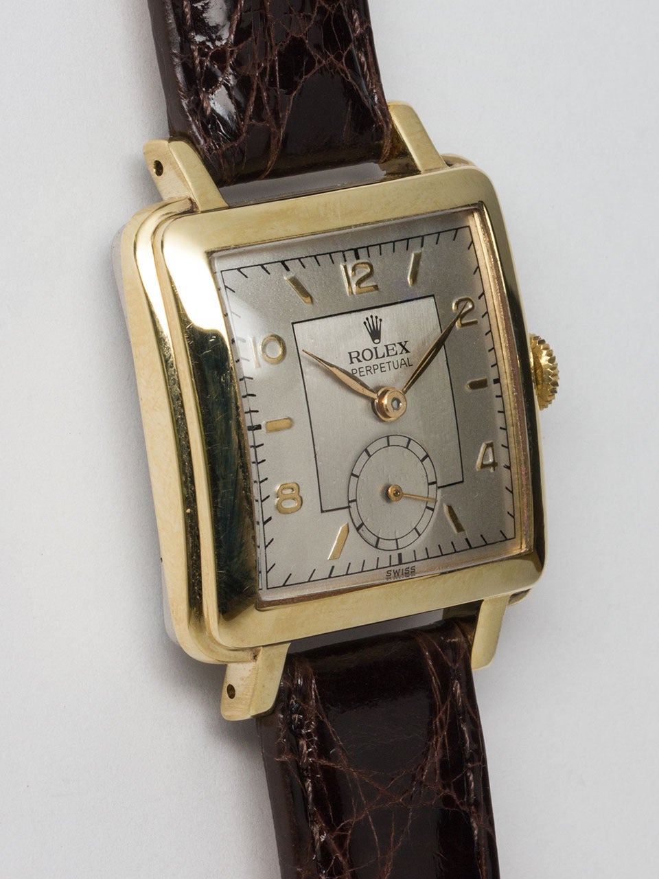 Rolex Yellow Gold and Stainless Steel Square Bubbleback circa 1950s. Largest of 3 sizes of this model produced, nicknamed “square bubbleback.” 31 x 39mm case with solid gold top and stainless steel back. Nicely restored 2 tone satin dial, gold