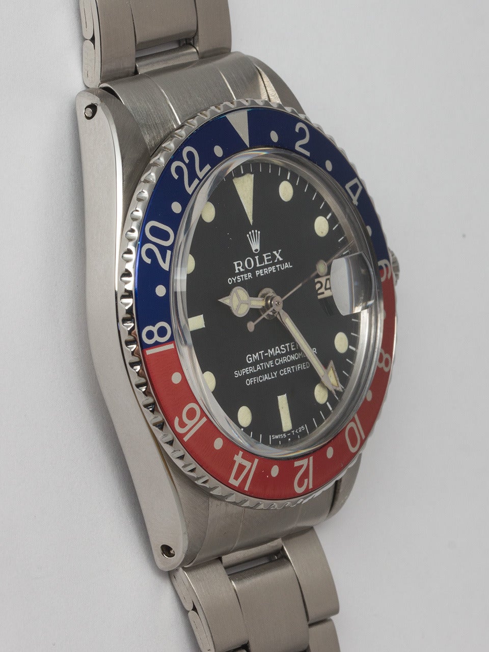 Rolex Stainless Steel GMT-Master Wristwatch ref 1675 serial #7.6 million circa 1982. 40mm diameter Oyster case featuring red and blue so called “Pepsi” bezel. Original matte black dial with ivory patina luminous indexes and matching hands. Powered