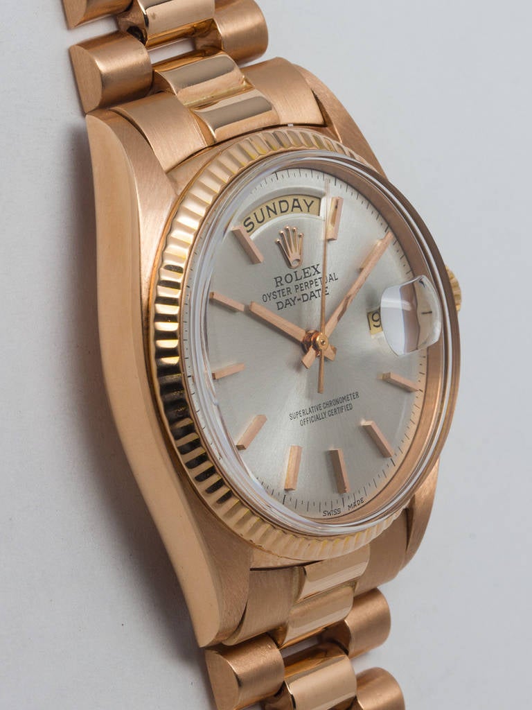 Rolex 18k rose gold Day-Date President wristwatch, Ref. 1803, serial wristwatch 3.4 million, circa 1973. 36mm case with fluted bezel, acrylic crystal, and beautiful original silvered satin pie-pan dial with applied pink indexes and pink baton hands.