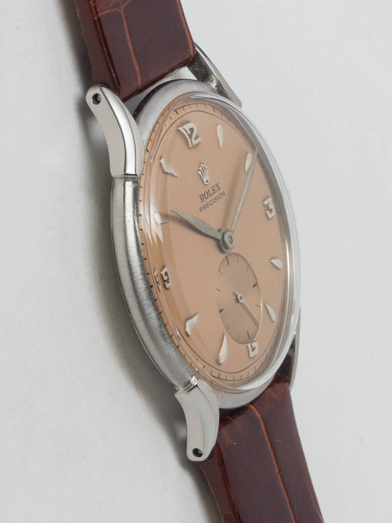 Rolex stainless steel dress model wristwatch, Ref. 4498, circa 1950s. 35 x 41.5mm snap back case with curved extended lugs and acrylic crystal. Nicely restored dial with raised indexes and leaf hands. 17-jewel manual-wind movement with subsidiary