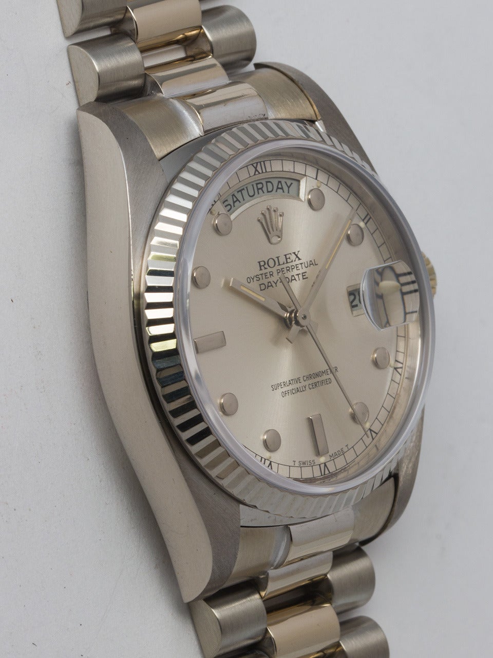 Rolex 18k white gold Day-Date wristwatch, Ref. 18039, serial number 6.2 million, circa 1980. 36mm full-size man's Oyster case with 18k white gold fluted bezel and sapphire crystal. Scarce original silvered dial with distinctive applied indexes and