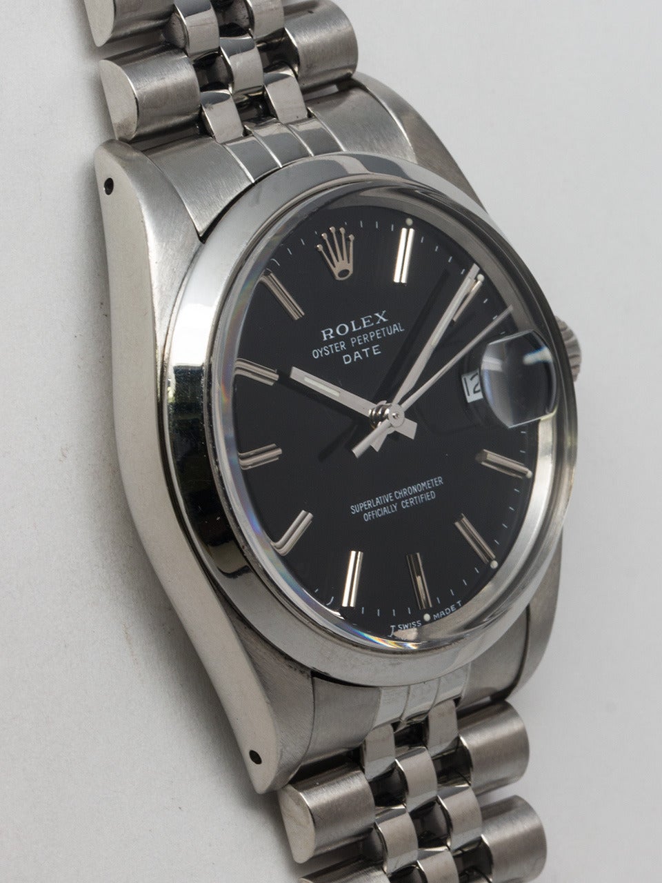 Rolex stainless steel Oyster Perpetual Date wristwatch, Ref. 15000, circa 1986. 34mm case with smooth bezel and acrylic crystal. Original glossy black dial with applied indexes and baton hands. Powered by a self-winding calibre 3035 movement with