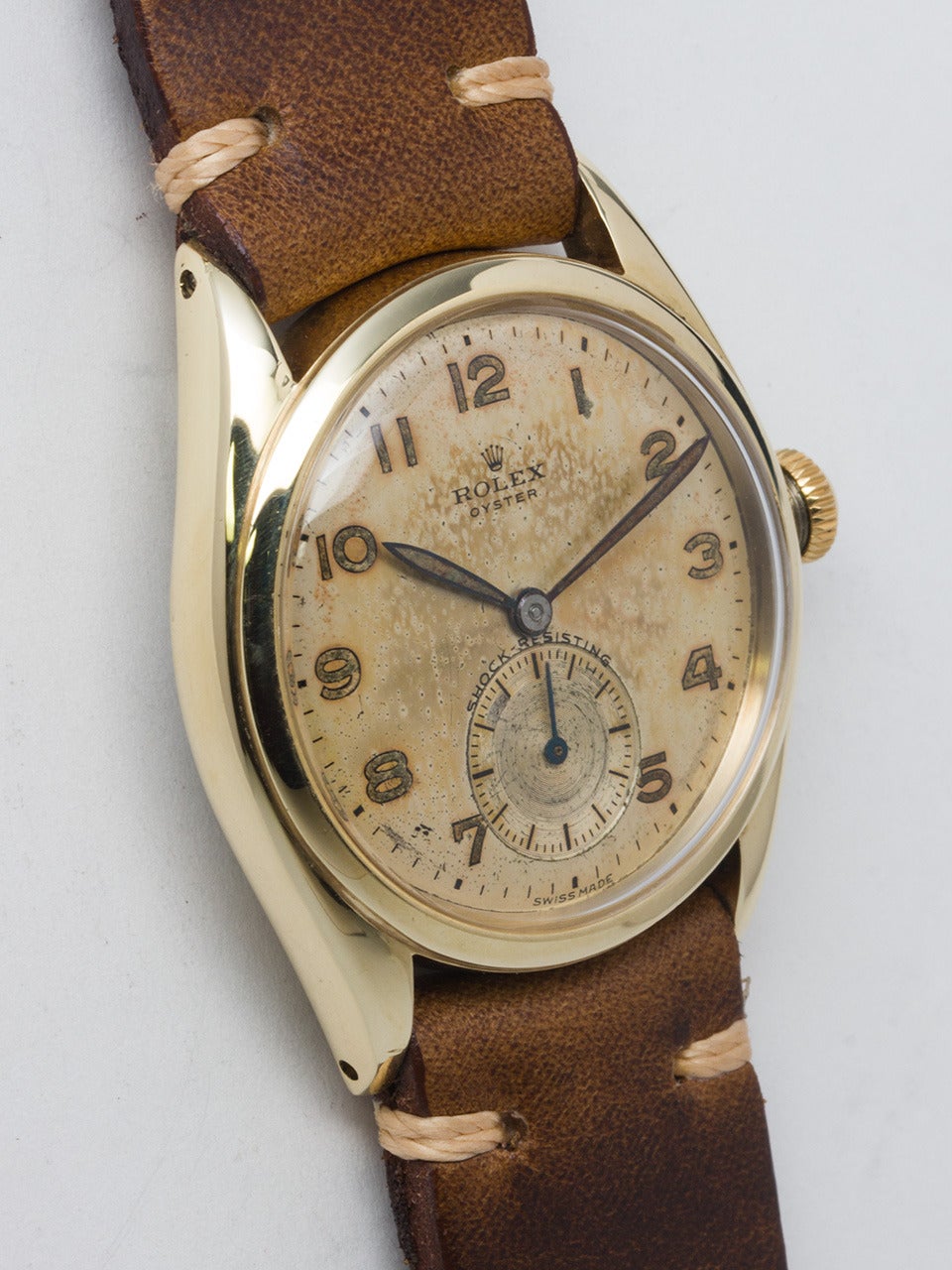 Rolex yellow gold top and stainless steel back Oyster wristwatch, Ref. 5022, circa 1948. 33mm case with acrylic crystal and signed crown. Very pleasing original luminous Arabic dial with nice patina. Manual-wind movement with subsidiary