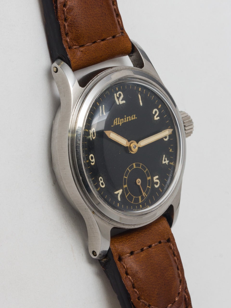 Alpina stainless steel military wristwatch, circa 1940s. 27.5 mm case and acrylic crystal. With original glossy black dial with luminous Arabic indexes and luminous pencil hands. 17-jewel manual-wind movement with sweep seconds. Very sharp looking