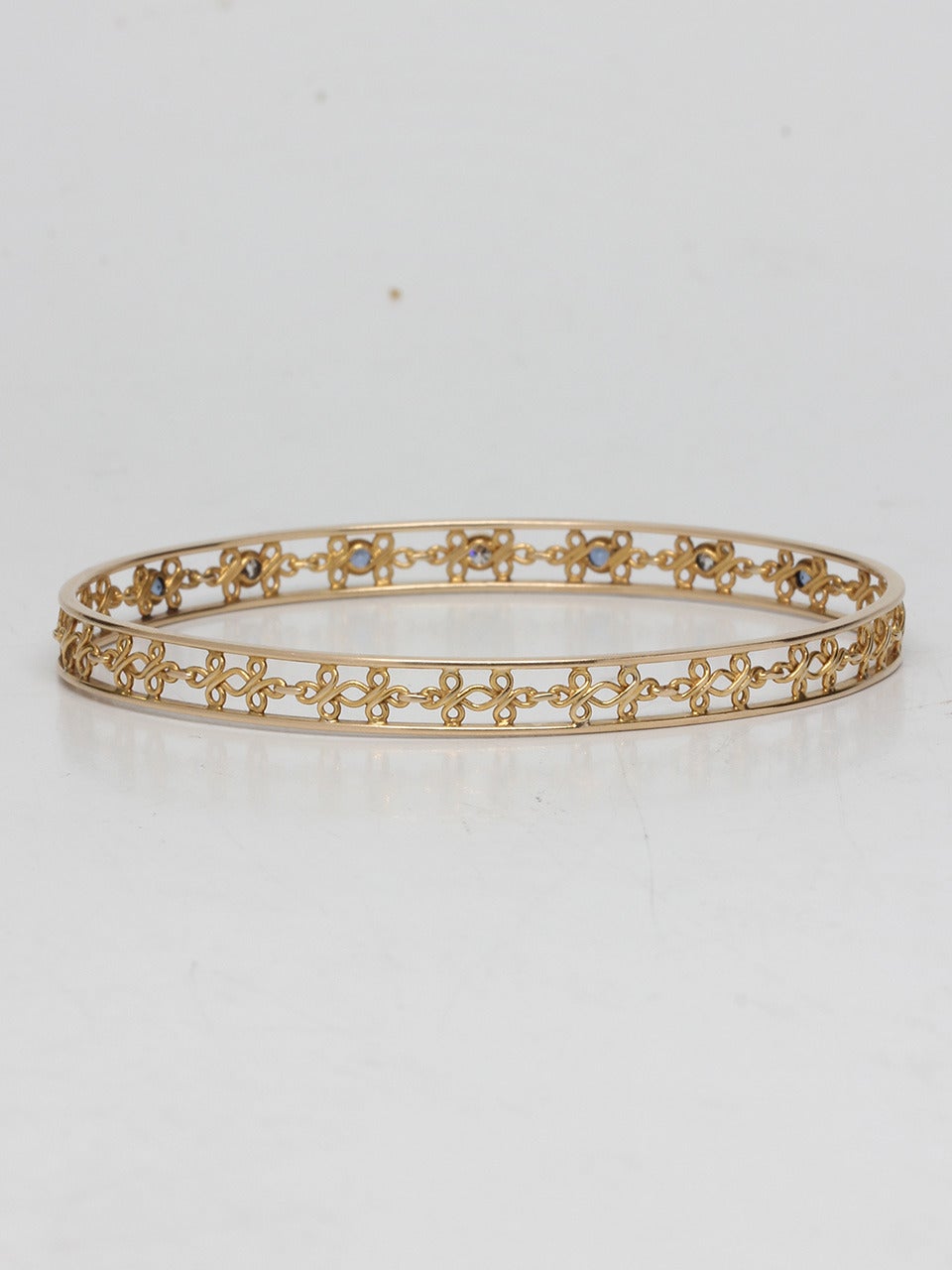 1930s 14K yellow gold diamond sapphire bangle bracelet with fine wire details. Alternating sapphires and Old European Cut diamonds. 6mm wide and Will fit over 10" hand. Point your fingers and measure your hand at knuckles. Very beautiful airy