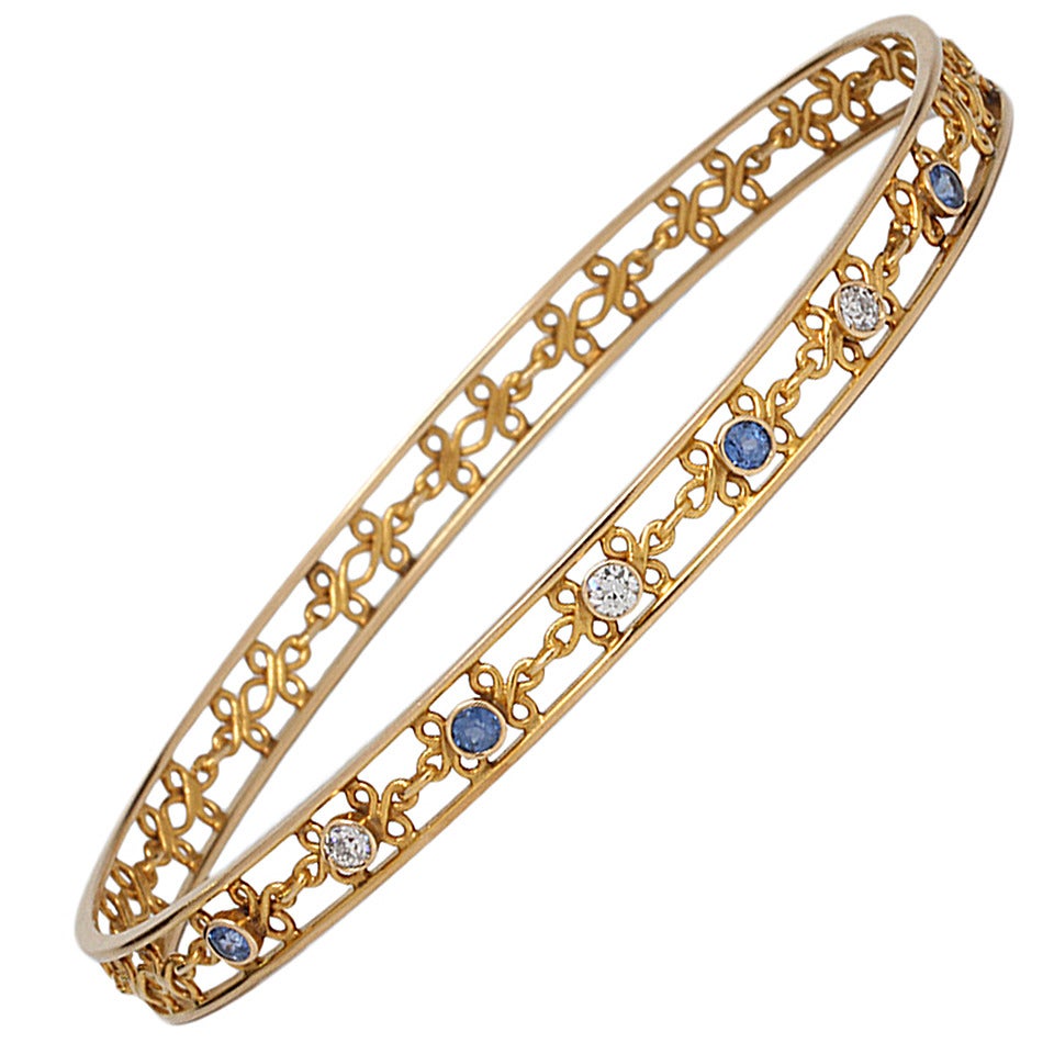 Vintage Diamond and Sapphire 14 Karat Yellow Gold Bangle Bracelet, circa 1930s