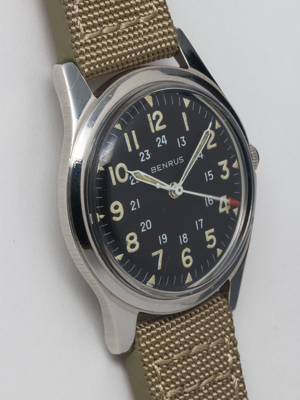 Benrus Steel Military Wristwatch, circa 1960s, 34mm case with smooth bezel, with original glossy black dial with luminous Arabic figures, inner 24-hour indications, and indexes and luminous hands. 17-jewel manual-wind movement with sweep seconds.