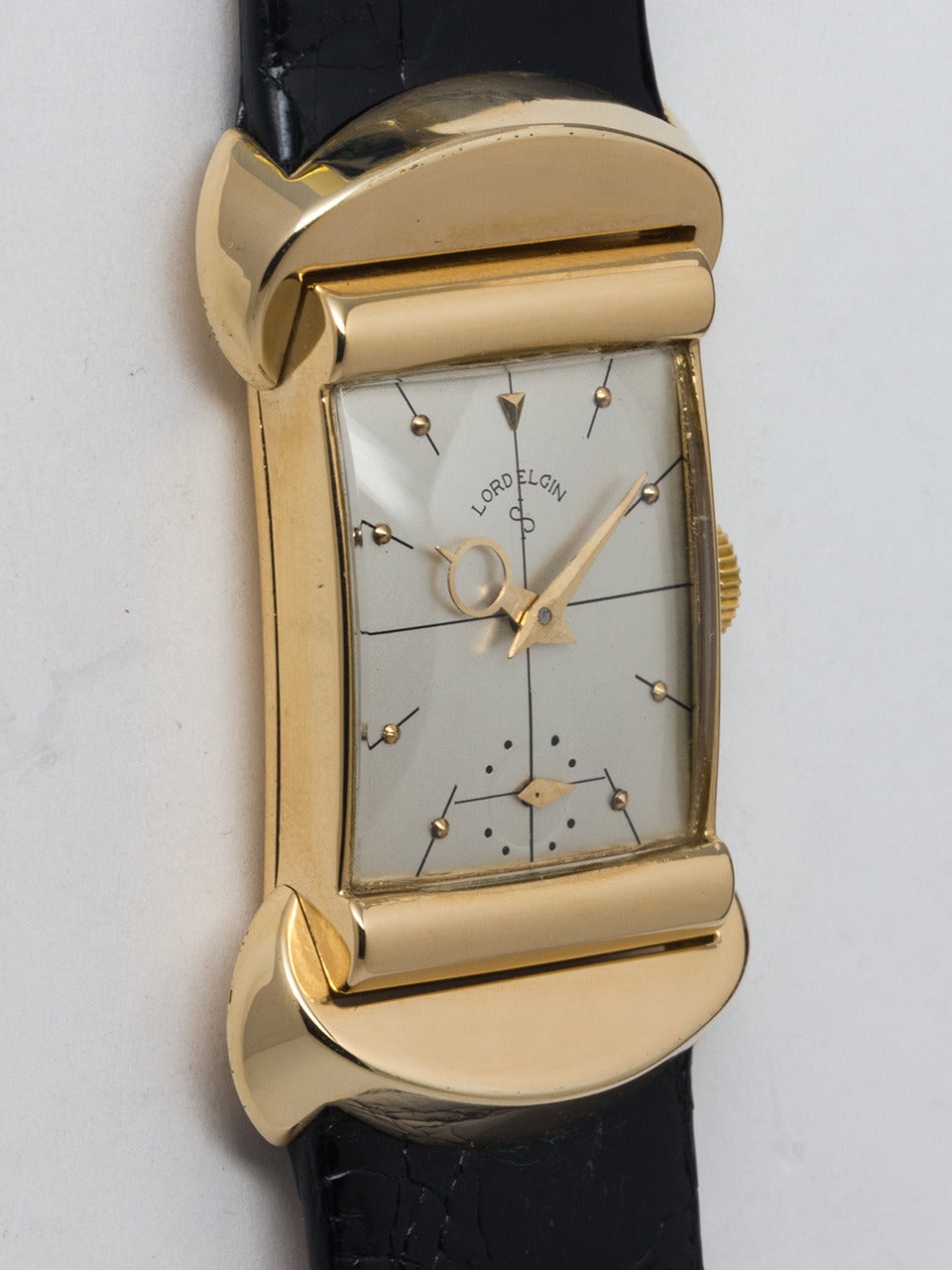 Lord Elgin 18k yellow gold 50 Millionth Anniversary wristwatch, circa 1951. 19 X 37mm case with hinged hooded lugs. Restored silvered dial with gold indexes and special hands exclusive to this model. Powered by a special gilt calibre 670  21-jewel