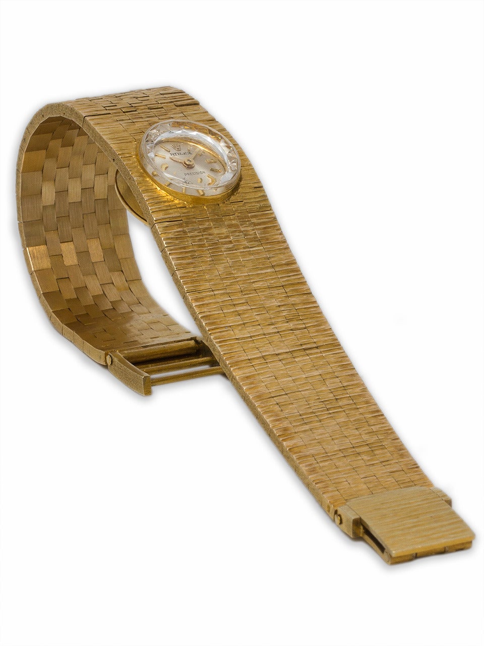 Rolex lady's 18k yellow gold textured bracelet watch, circa 1960s. Great looking and heavy 45.5 grams weight overall. Mint condition original silvered satin dial with applied indexes and Rolex logo. Signed Rolex crown. Original cut crystal. 6 inches