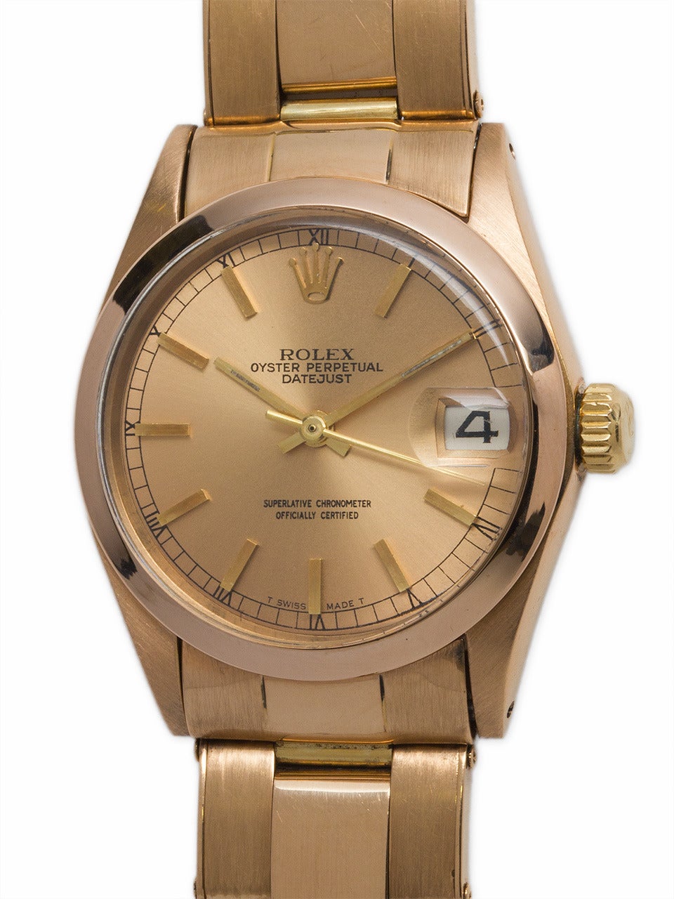 Rolex 18k rose gold midsize Datejust wristwatch, Ref. 6517, serial number 1.3 million, circa 1966. 31mm case with smooth bezel and rose dial with applied indexes. Self-winding movement with sweep seconds and date. With riveted link 18k rose gold