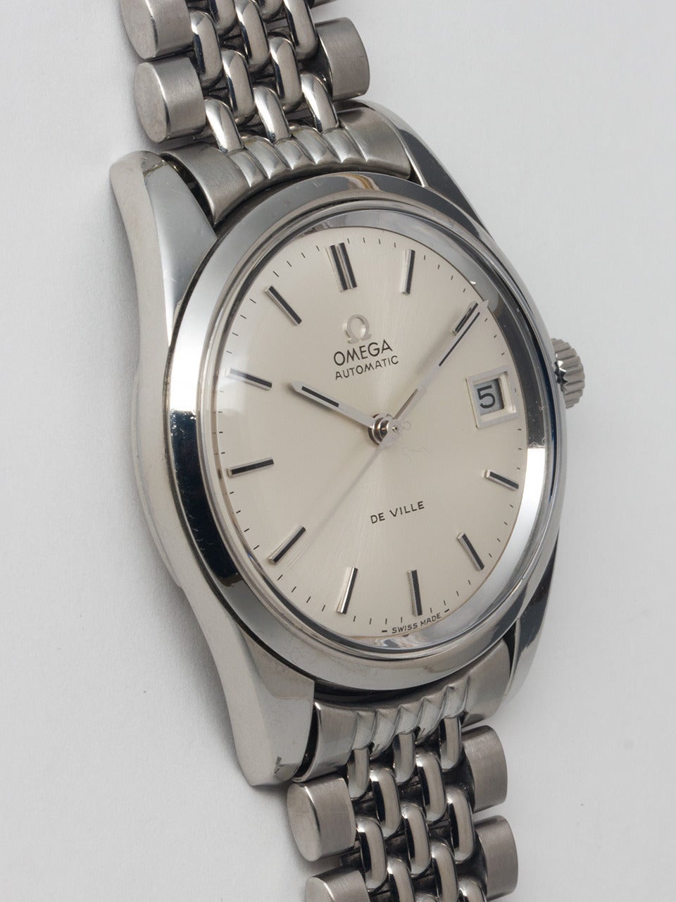 Omega Stainless Steel Automatic De Ville Wristwatch, Ref. 166.010, serial number 24862896, circa 1966. 34mm case with wide bezel and heavy lugs. Very pleasing original silvered satin dial with applied baton indexes and baton hands. Powered by a