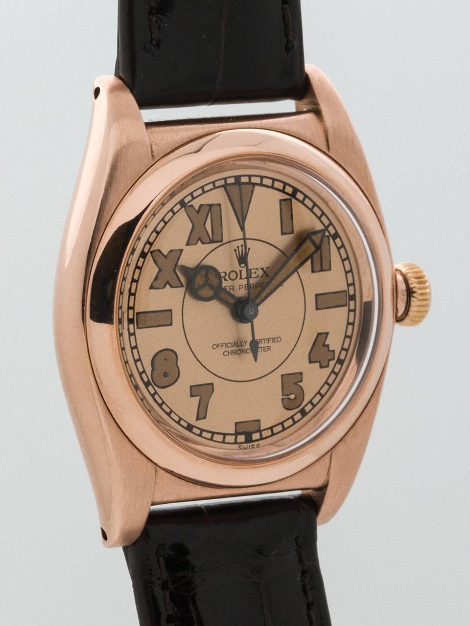 Rolex Rose Gold and Stainless Steel Bubbleback serial # 302,xxx circa 1945. 32mm diameter tonneau shaped 3 piece case with screw down smooth bezel and stainless steel case back . Beautifully restored antique salmon 'tropical' dial with patina’d
