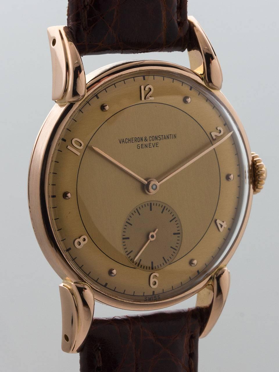 Vacheron & Constantin 18K Rose Gold Large Dress Wristwatch circa 1950s. 34 x 44mm large and beautiful case with elegant lugs, crown and acrylic crystal. Two tone antique salmon dial with applied rose color Arabic numerals, indexes and hands. Powered