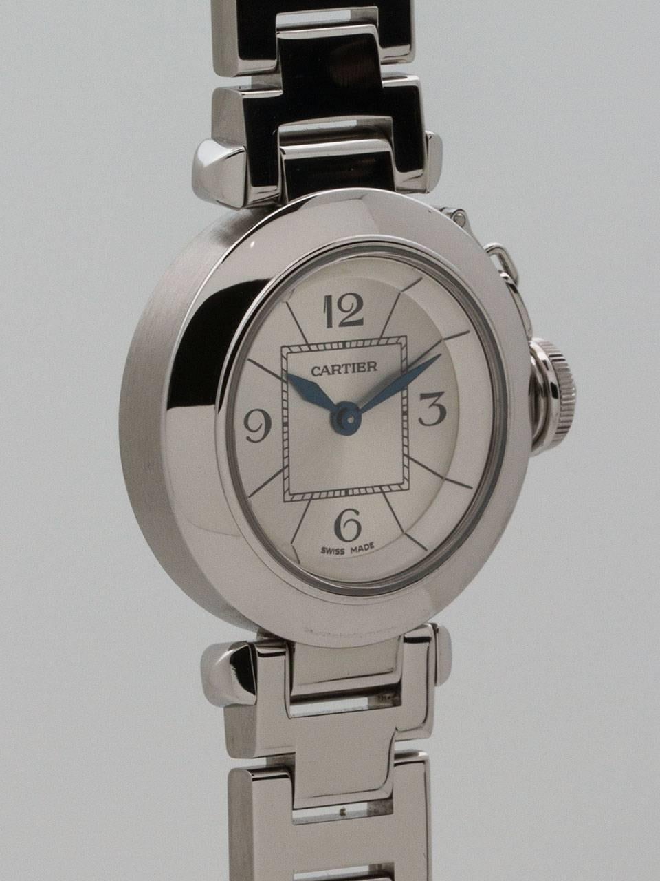 Lady’s Cartier Stainless Steel Mini Pasha ref 2973 circa 2000s. 27 x 34mm case with smooth bezel and sapphire crystal. The case also features a blue cabochon sapphire crown protector. Original silvered dial with printed Arabic numerals and blue