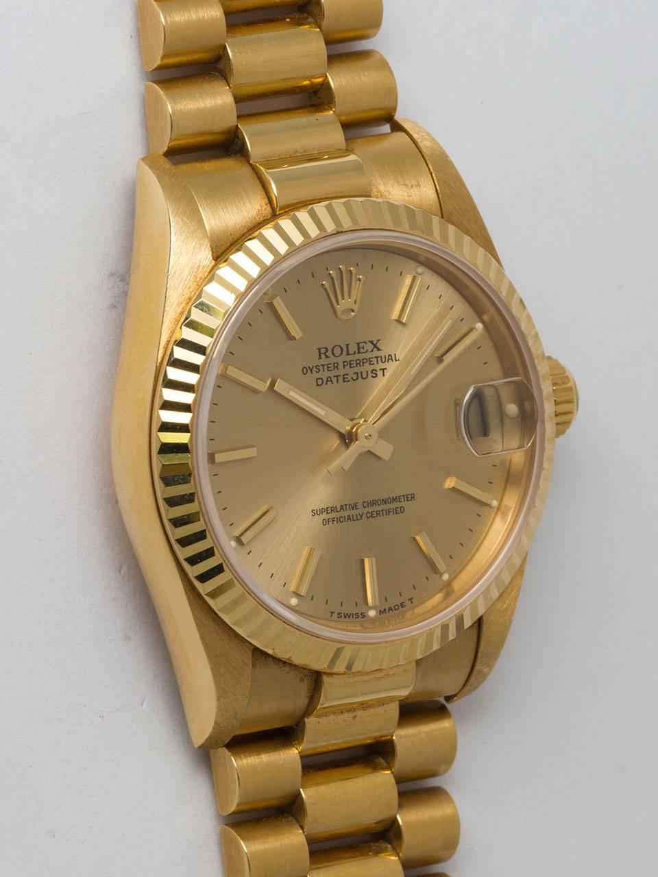 Rolex 18K Yellow Gold Midsize Datejust ref 68278 serial #W6 circa 1996. 30mm diameter Oyster case with fluted bezel and sapphire crystal. Original gold color dial with applied gold indexes and hands. Powered by automatic movement with quick set