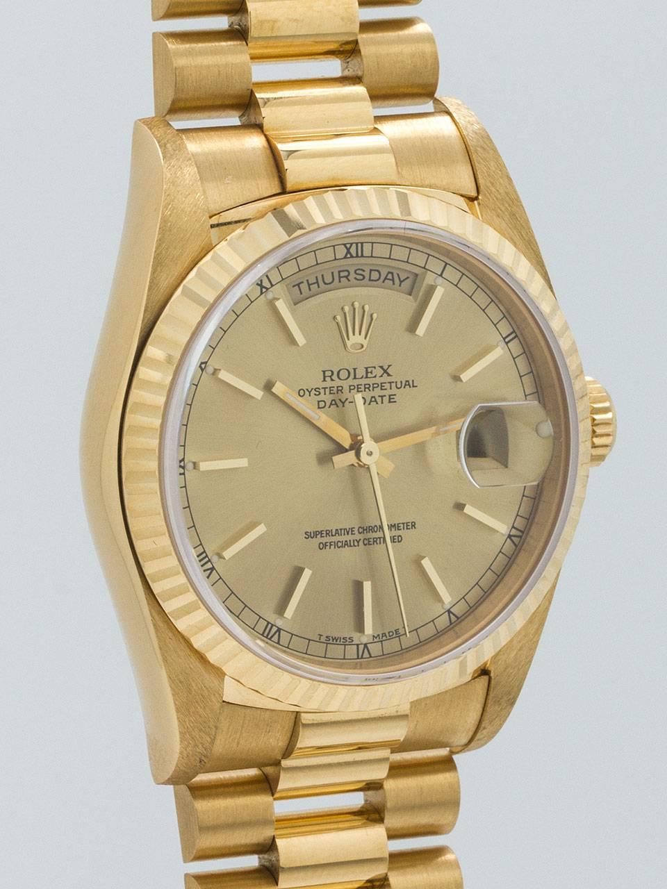 Rolex 18K Yellow Gold Day-Date President ref 18238 serial number E3 circa 1991. 36mm diameter case with fluted bezel and sapphire crystal. Original champagne dial with gold applied indexes and gilt baton hands. Powered by self winding calibre 3165