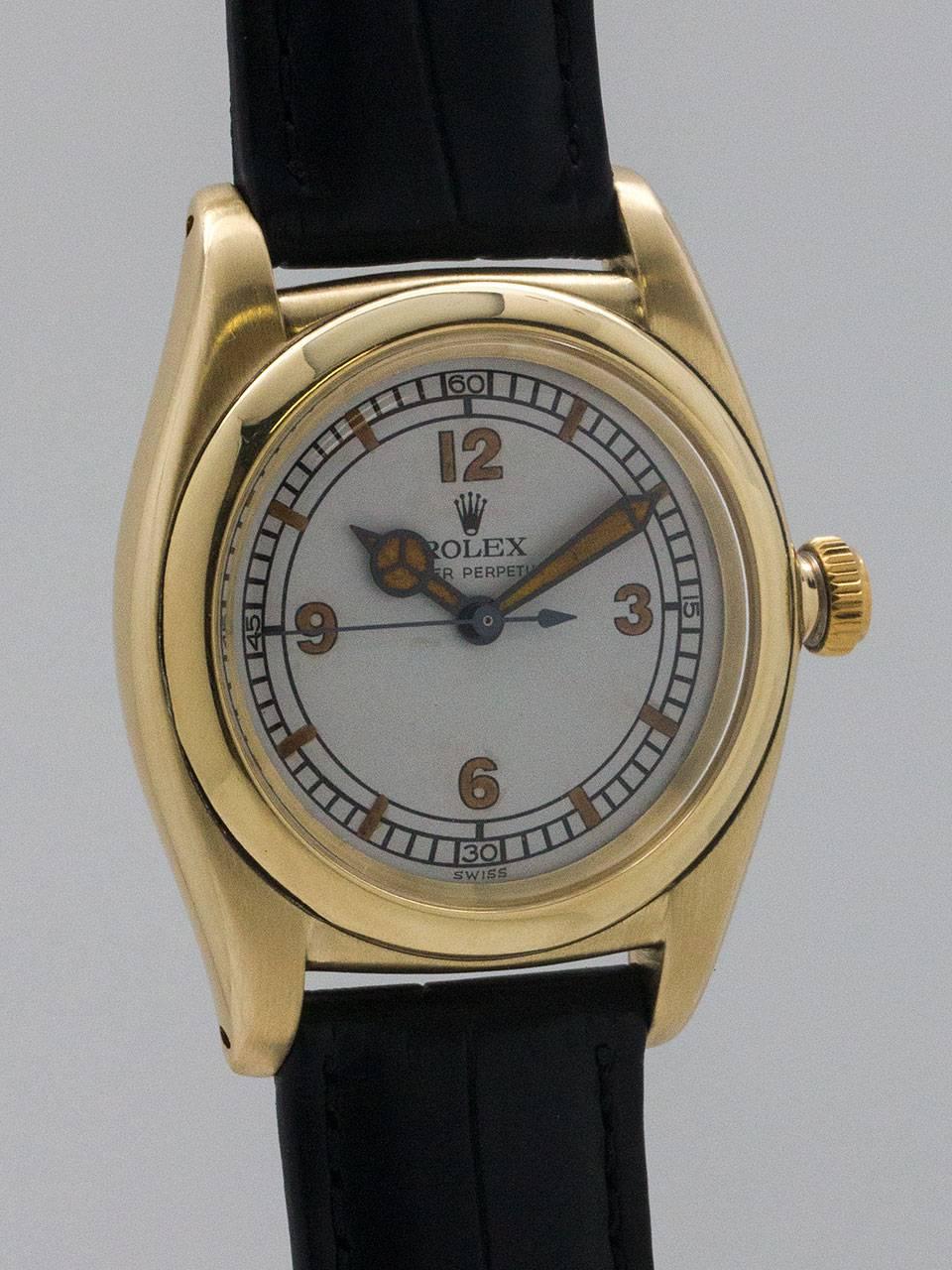 Rolex 14K Yellow Gold Bubbleback Wristwatch ref 3131 circa 1940s. 32mm diameter tonneau shaped Oyster case with screw down caseback and screw down period style bubble back crown. With beautifully restored antique white dial with sector style antique