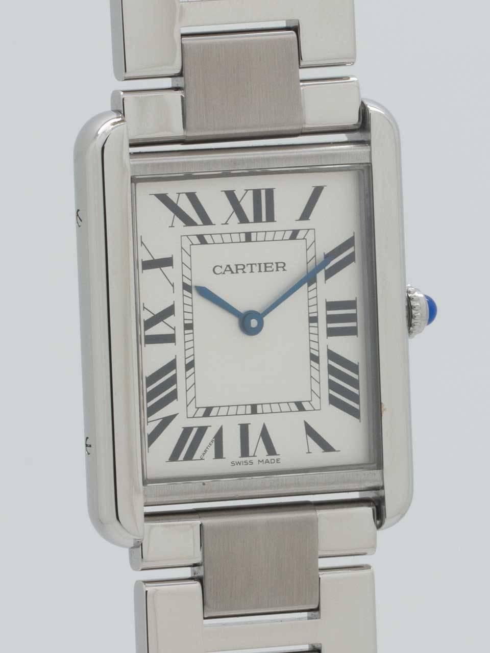 Cartier Man’s Stainless Steel Tank Solo Wristwatch. 27 x 34mm flat design case secured by 4 side and 4 caseback screws. With sapphire crystal and cabochon sapphire crown. Classic silvered dial with Roman figures and blued steel hands. Powered by