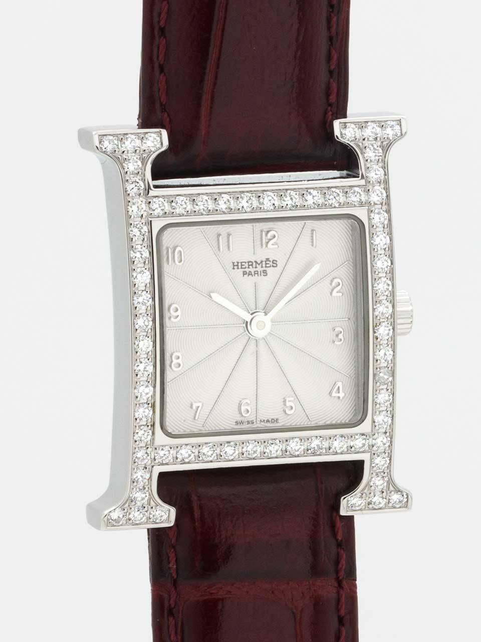 Lady's Hermes Stainless Steel and Diamond H-Hour Wristwatch ref HH1 230 circa 2000s. 21 x 30mm stainless steel H shaped case with diamond set bezel and lugs. Sapphire crystal and signed crown. Silvered guilloche dial with applied Arabic numerals and