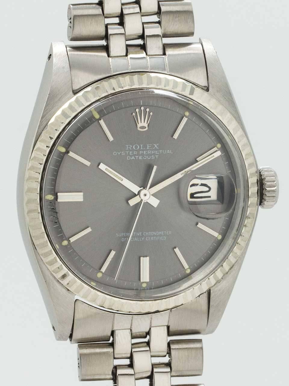 Rolex Stainless Steel Oyster Perpetual Datejust ref 1601 serial number 2.8 million circa 1971. 36mm diameter case with 14K white gold fluted bezel and acrylic crystal. Original gray pie pan dial with applied silver indexes and silver baton hands.