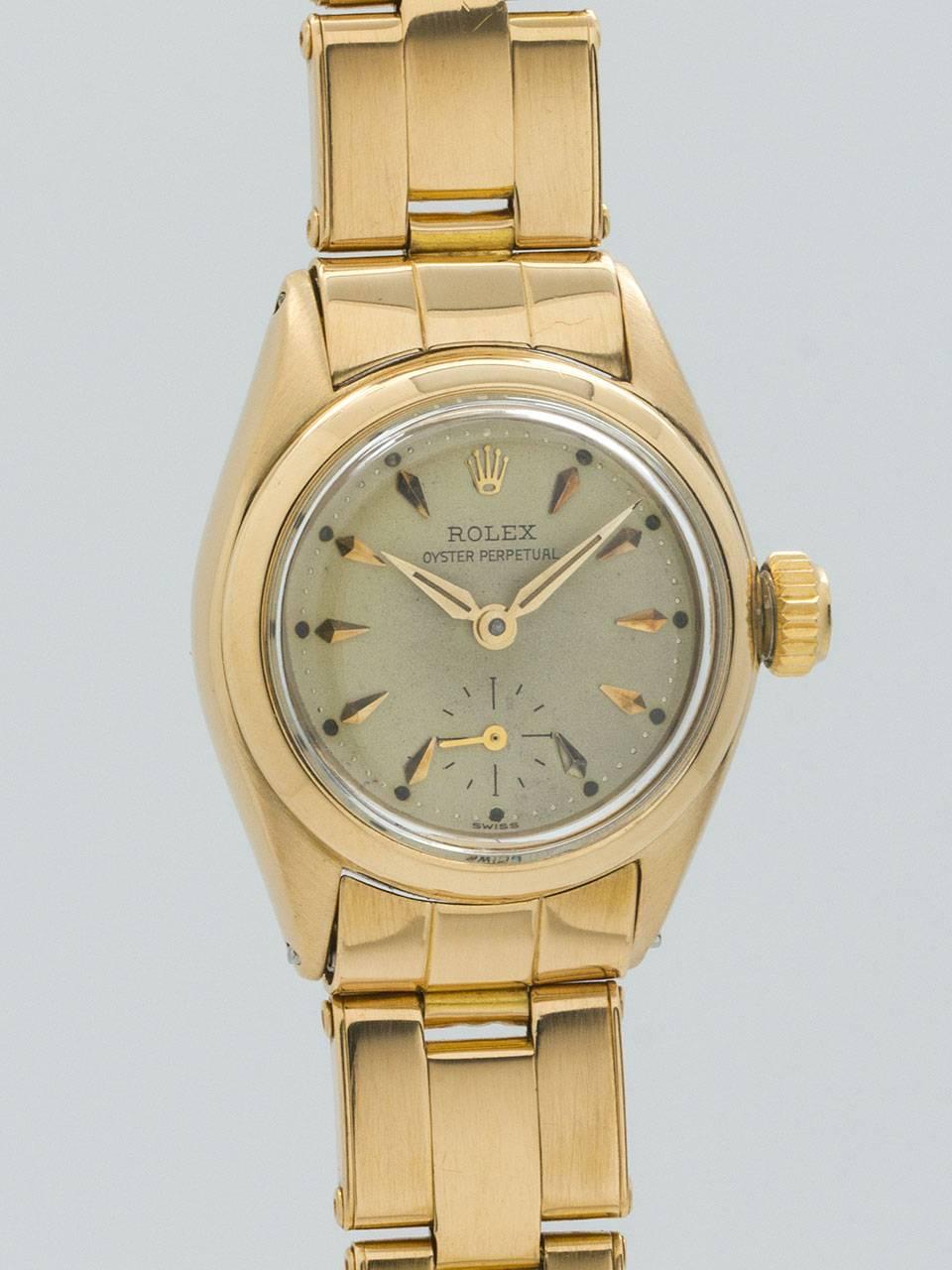 Lady's Rolex 18K Yellow Gold Oyster Perpetual Wristwatch ref 6502 serial #100,xxx circa 1955. Small size, 25 mm diameter Oyster case with screw down case back and screw down period crown. Smooth bezel and acrylic crystal. Original warmly patina’d